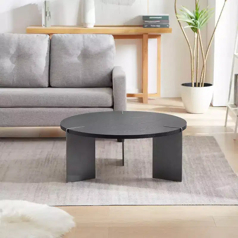 Table basse ronde avec plateau en noyer et piétement en métal noir, pièce maîtresse moderne pour le salon